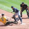 Apr 17, 2016; Pittsburgh, PA, USA; Milwaukee Brewers catcher Jonathan Lucroy (20) steps on home plate to force out Pittsburgh Pirates shortstop Jordy Mercer (10) during the third inning at PNC Park. Mandatory Credit: Charles LeClaire-USA TODAY Sports